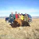 Five Hunters Posing Next to Buffalo